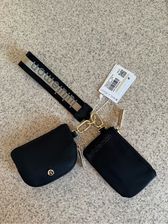 NWT Lululemon Dual Pouch Wristlet Keychain Wallet Black and  lululemon Black and White Dual Pouch Wristlet with Branded Strap
